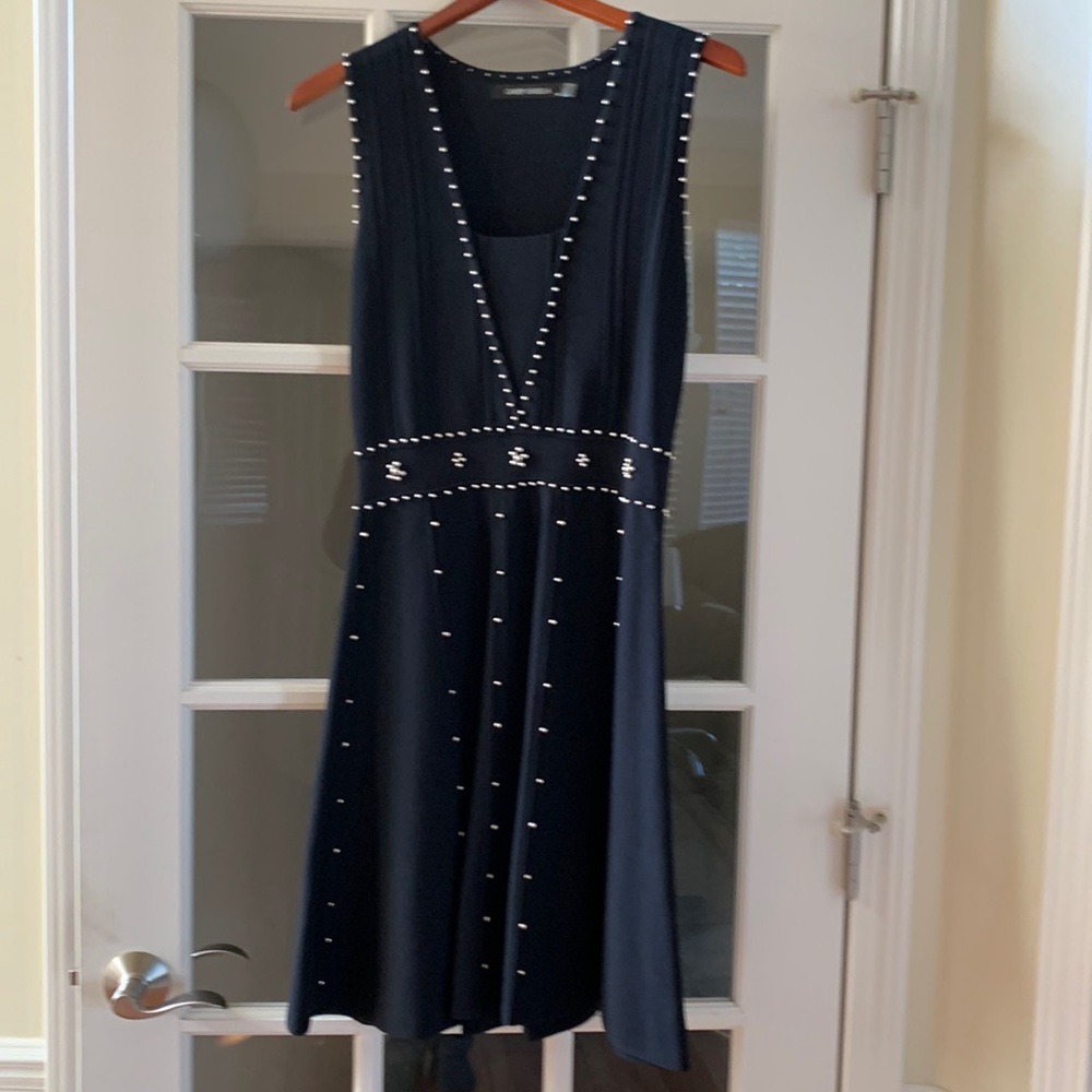 Black dress embellished with gold studs